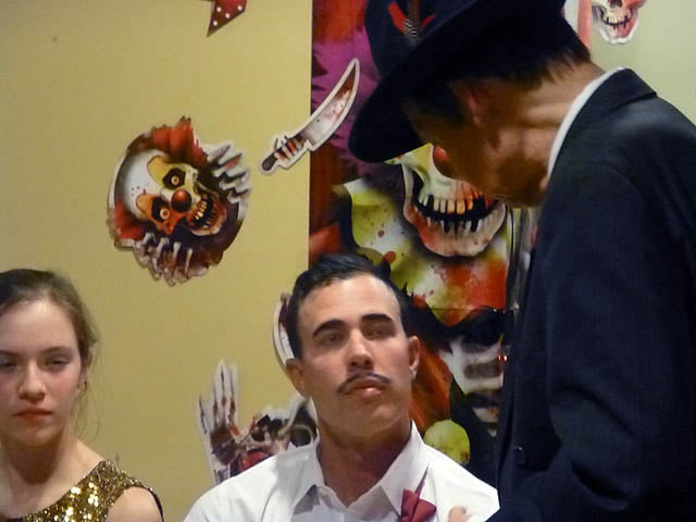 Man has an entranced gaze at a Chicago area Halloween home hypnosis show.