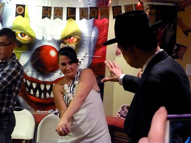 Hypnotist freezes woman stiff at a Chicago area  Halloween home hypnosis show.