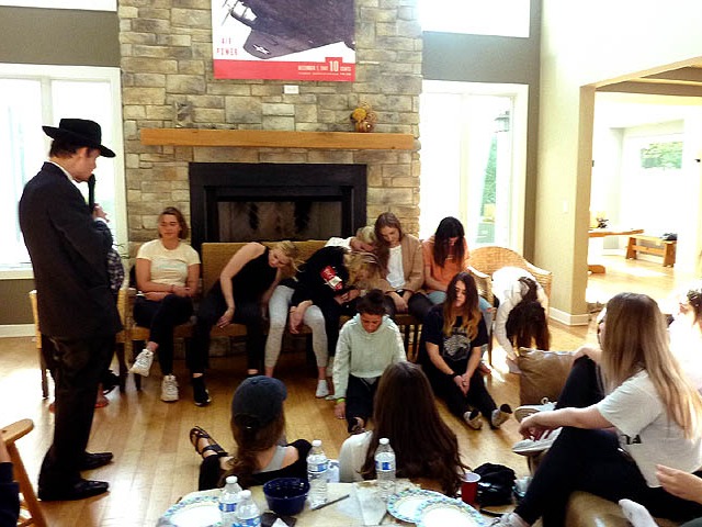 Volunteers getting hypnotized at sorority Chicago area hypnosis show.